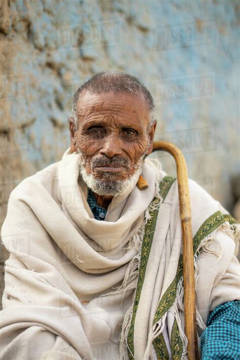 Portrait Of Ethiopian Senior Man With Traditional Clothing And Stick