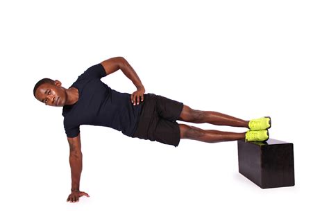 Fit Man Doing Side Plank With Feet Elevated