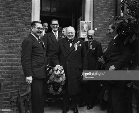 Winston Churchill Grips The Collar Of The Bulldog Mascot Of His