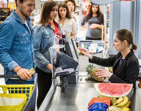 People Buying Goods In A Grocery Store Stock Photo Image Of Operator