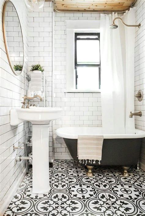 The hexagon black tiles used for the floor create the perfect contrast with the white subway tiles used around the bathroom. Subway tile and painted clawfoot tub in bathroom. Love. # ...
