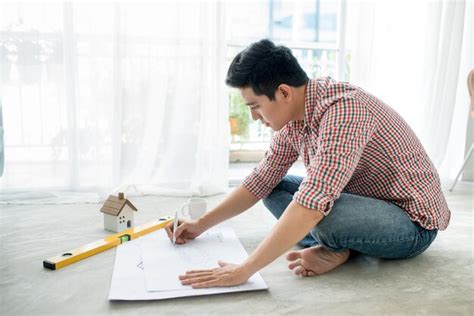 Premium Photo Young Handsome Male Asian Architect Working At Home On