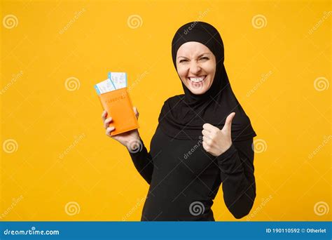 Traveler Tourist Young Arabian Muslim Woman In Hijab Black Clothes Hold Passport Tickets