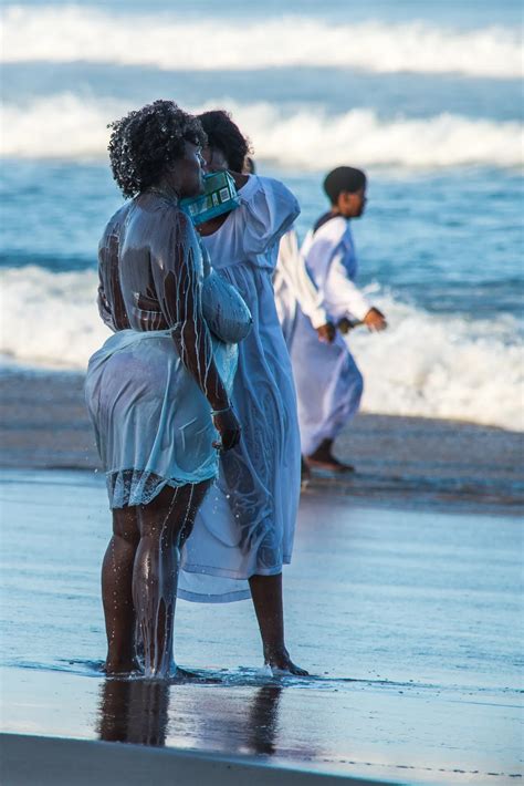 Woman Bathing Another Woman In Milk On The Shore Of The Indian Ocean Durban South Africa