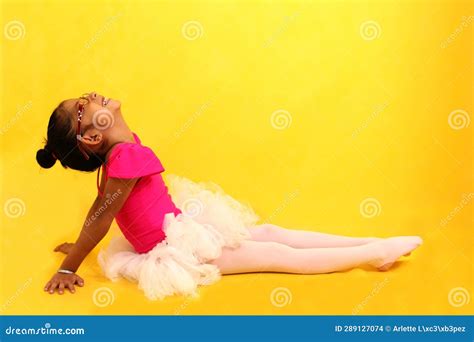 4 Year Old Latina Brunette Girl Dressed As A Ballerina Practices Sport