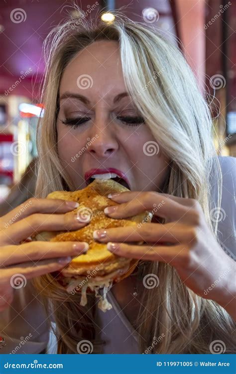 blonde model eating a sandwich after a long day of modeling stock image image of carbs bread