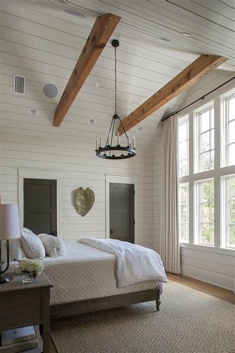 Cottage Bedroom With Gray Shiplap Vaulted Ceiling Features Two Oak Wood