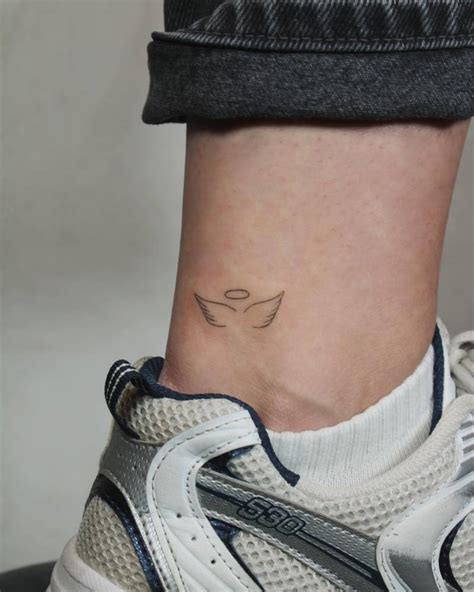 Angel Wings And Halo Tattoo Located On The Ankle