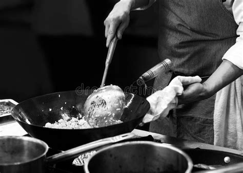 Chef Cooking In A Kitchen Chef At Work Black And White Stock Image