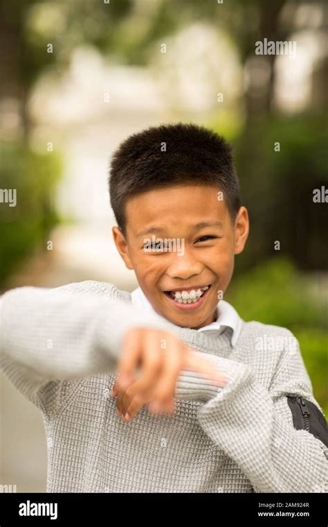 Asian Boy Smiling And 12 Hi Res Stock Photography And Images Alamy