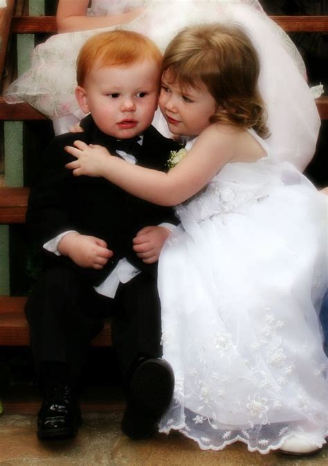 Flower Girl And Ring Boy Getting A Hug At A Wedding By Ponces