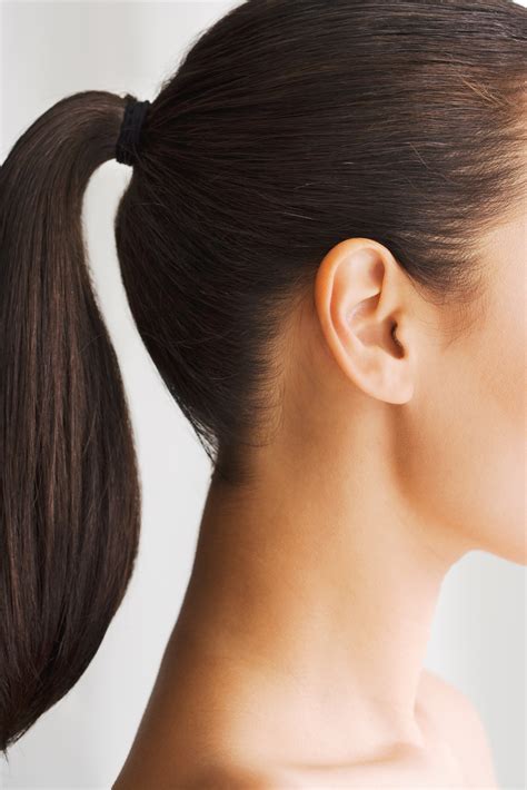 If your hair is wavy or straight, work a treatment oil formulated for your hair type through the ends and gather your hair into a loose, high ponytail or bun before bed. Wearing Hair Ties on Your Wrist May Not Be So Healthy | Allure