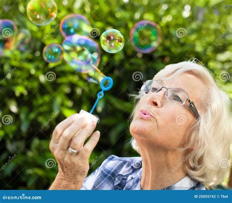 Senior Woman Blowing Bubbles Stock Photo Image Of People Beauty