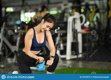 Young Woman Working Out With Kettlebells In Gym Stock Image Image Of