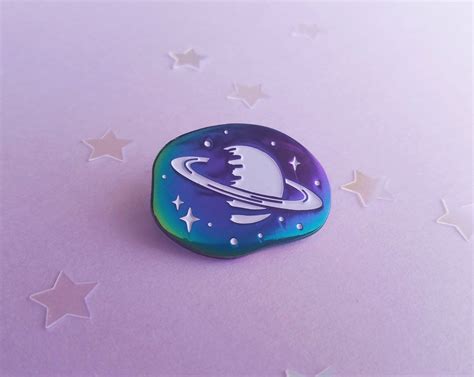 Carry A Little Slice Of The Cosmos With You With Our Rainbow Saturn Pin