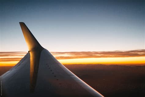 Plane Wing At Sunset By Stocksy Contributor Simone Wave Stocksy