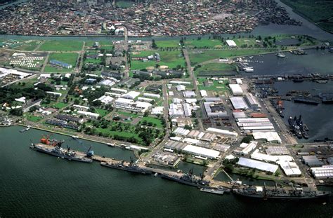 a view of the naval base subic bay with the city of olongapo in the background the ships