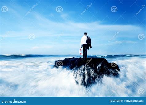 Man Standing On The Rock Overlooking Tropical Mountains At Sunrise