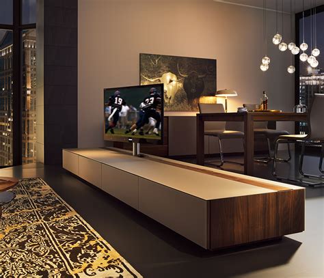 For instance, this tv unit, with a combination of open and closed shelves, displays innate symmetry and looks classy by virtue of being black. Luxury rotating Flat Screen TV cabinet - Cubus - Wharfside