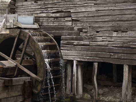 Water Mill Wheel Rotates Under A Stream Of Water Traditional Village