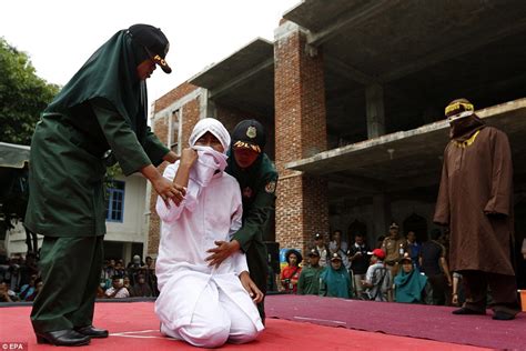 Indonesian Woman Sobs As She Is Caned In Public For Having Sex Outside