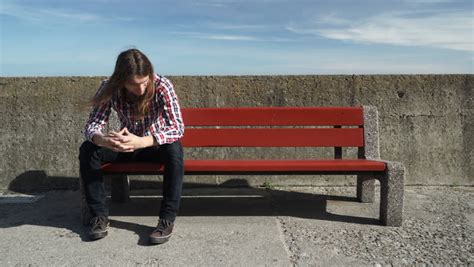 Stock Video Clip Of Man Sitting Alone On Bench Sad Worried