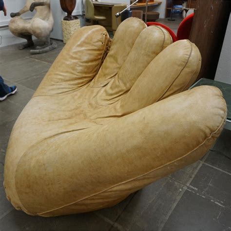 A baseball glove or mitt is a large leather glove worn by baseball players of the defending team, which assists players in catching and fielding balls hit by a batter or thrown by a teammate (source. 1970s Vintage Leather "Joe" Baseball Glove Chair | Chairish
