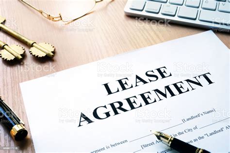 Real estate leases are also commonly known as rental agreements. Rental Lease Agreement Form On An Office Desk Stock Photo ...