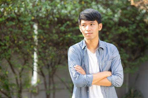 Portrait Of A Young Handsome Asian Man With Trendy Hairstyle Stock