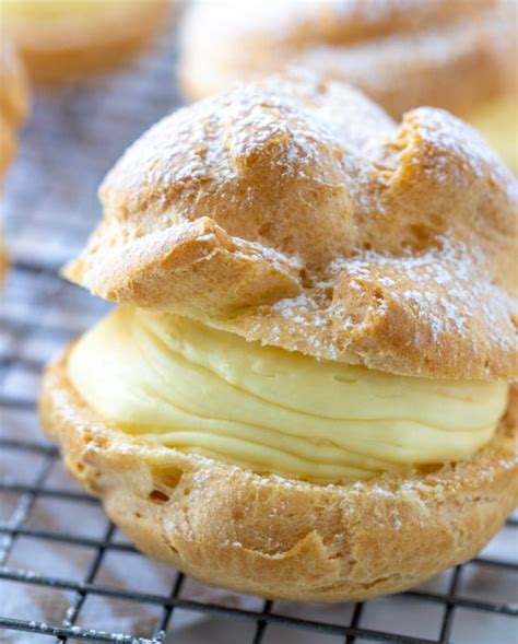 This cream puff cake is a light and fluffy dessert that just might become your new favorite sweet recipes for spring and summer. Homemade Cream Puffs | Wishes and Dishes
