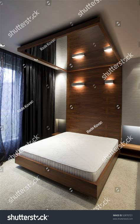 This mirroring stretch ceiling look like huge glass on the ceiling without join line and superb surface. Bedroom With Mirror On The Ceiling Stock Photo 52870721 ...