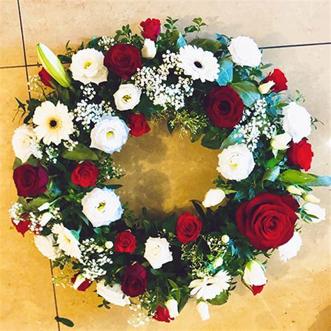 It's completely up to you what you write on the. Large Round Wreath of funeral flowers. Order Online.