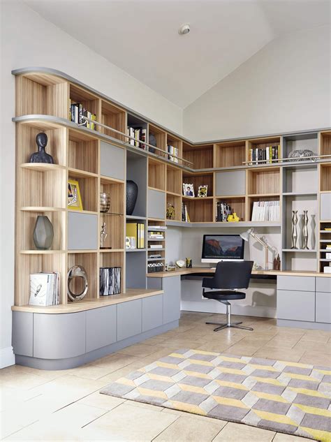 If you are the kind of person that needs entertainment running at the back while you sit down to study or work this modern study table design won't fail you. Grey Modern Library & Home Office in 2020 | Study room ...