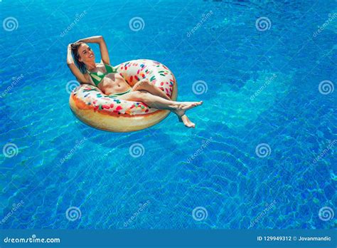 Enjoying Suntan Woman In Bikini On The Inflatable Mattress Stock Photo