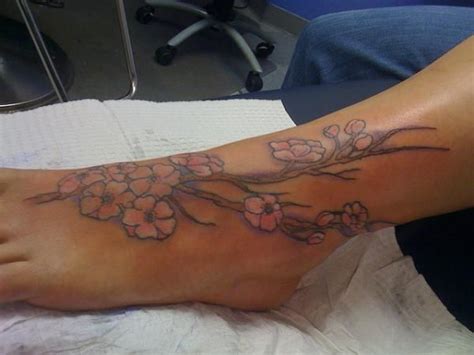 25 Flower Tattoos On Foot You Should Look At Slodive Foot Tattoo