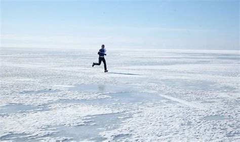 Worlds Most Extreme Marathon Runners Travel Over Frozen Lake In