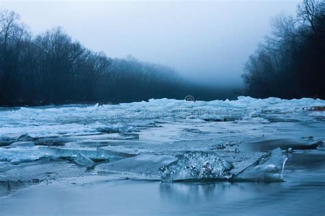 Water In River Flowing Around Large Blocks Of Ice In Winter Nature