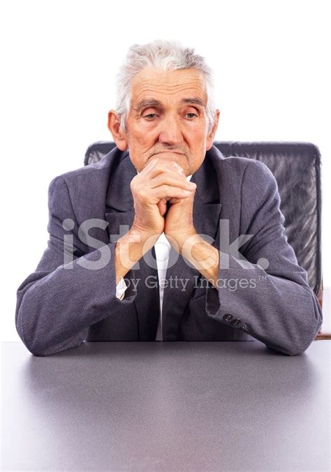 Portrait Of A Thoughtful Elderly Man Holding His Hands Together Stock