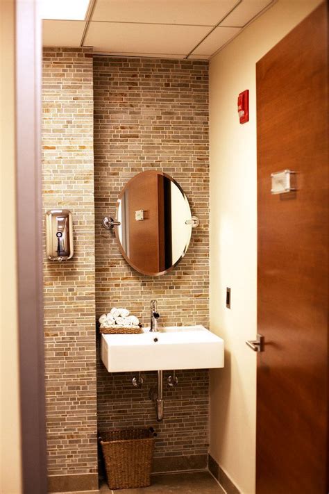 This minimal, rustic bathroom makes the best out of the least amount of decor possible, with a wooden ladder for the towels, a concrete floor, and open wood vanity. Creative Design Tips for A Narrow Bathroom | Bathroom ...