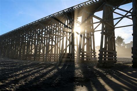 Sunlight Through The Trestle Photograph By Art Block Collections Pixels