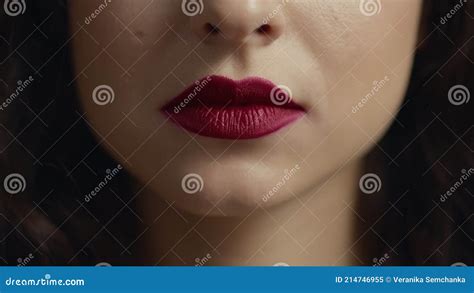 Close Up Of Unrecognizable Girl Face Licking Red Plump Lip With Tongue