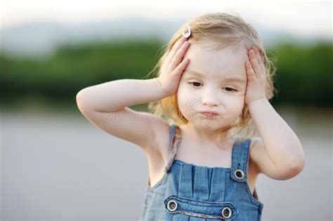 Adorable Little Girl Making Funny Face Royalty Free Stock Photos