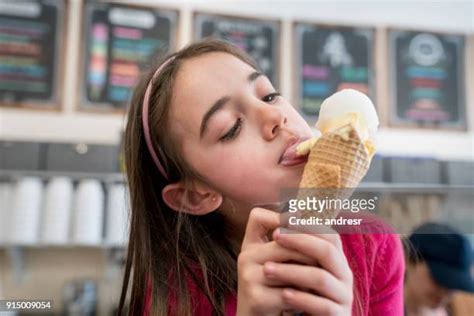 Girl Licking Ice Cream Photos And Premium High Res Pictures Getty Images