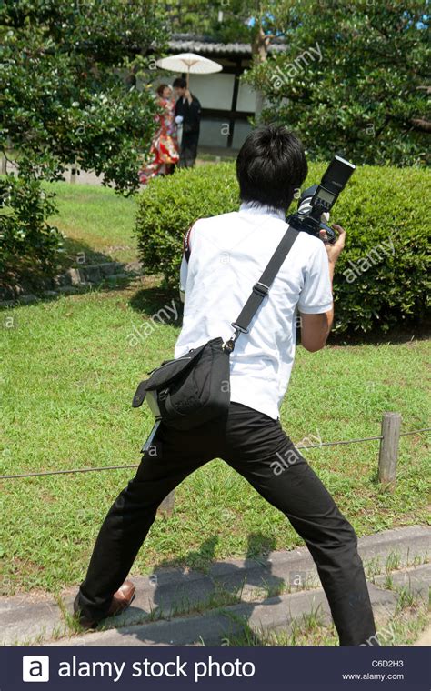 Photographer In Action Stock Photo Alamy