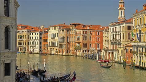 People In Boat On River Between Buildings In Italy Venice Hd Travel