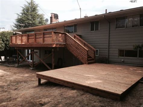 Three tiers of premium composite and aluminum deck and porch railing. Cedar deck with horizontal railing | Deck Masters, llc ...