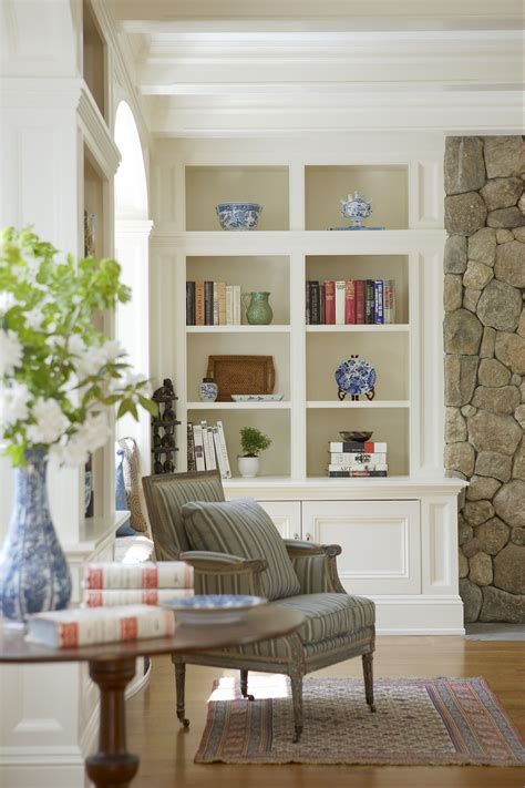 Built In Bookcases And White Finishes Make A Welcoming Sitting Area