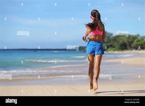 Woman Runner Running Barefoot On Sand At Beach Female Athlete With
