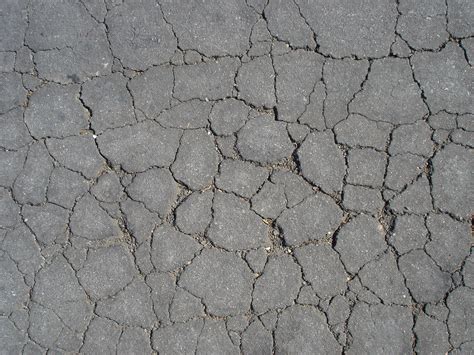 Damaged And Broken Asphalt Background Texture