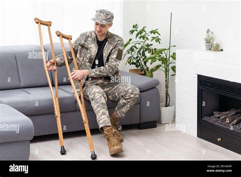 Military Wounded Soldier Using Crutch Stock Photo Alamy